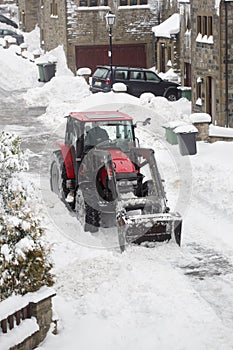 Snowplough clearing a residential road