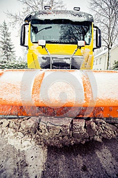 Snowplow clearing road, winter service truck