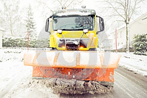 Snowplow clearing road, winter service truck