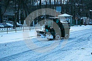 Snowplow removing snow on street after blizzard