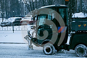 Snowplow removing snow on street after blizzard