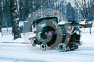 Snowplow removing snow on street after blizzard