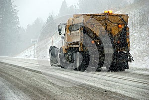 Snowplow truck on icy road