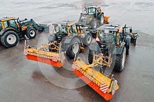 Snowplows Tractors on the airfield at the airport. Snowblower.