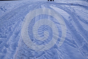 Snowscape with skid marks into the snow