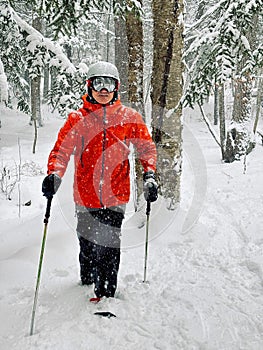 Snowshoeing in a Canadian forest during a snow squall photo