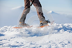 Snowshoeing in Carpathian mountains in wintertime