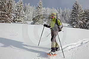 Snowshoeing in Carpathian mountains in wintertime