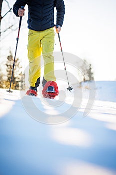 Snowshoeing in winter in deep snow.