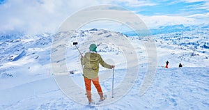 Snowshoer, taking selfie on Dachstein-Krippenstein slope, Salzkammergut, Austria