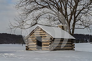 Snow Covered Log Cabin at Valley Forge