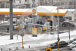 Snowstorm on the street with Shell gas station. Sofia, Bulgaria.