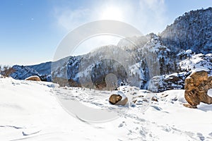 Snowstorm at the top of the mountain. Snowy plateau of a low mountain during heavy snowfall