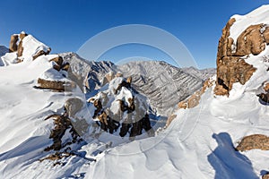 Snowstorm at the top of the mountain. Snowy plateau of a low mountain during heavy snowfall