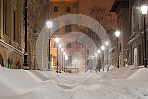 Snowy alley at night