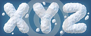 Snowy alphabet with letters X, Y, Z. Lettes made of snow. Winter font isolated on blue background photo