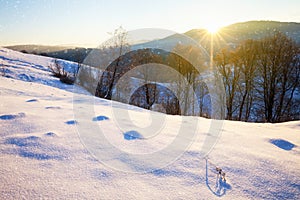 Snowy Alpine mountain hills at sunny day