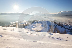 Snowy Alpine mountain hills at sunny day