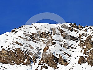 Snowy alpine mountain peak ChÃÂ¢tillon located in a mountain massif of the Bernese Alps Alpes bernoises, Les Diablerets - Suisse photo