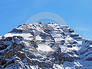 Snowy alpine mountain peak Culan in the Les Diablerets massif seen from the Les Diablerets settlement - Switzerland