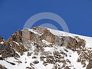 Snowy alpine mountain peak La Pare located in a mountain massif of the Bernese Alps Alpes bernoises, Les Diablerets - Suisse