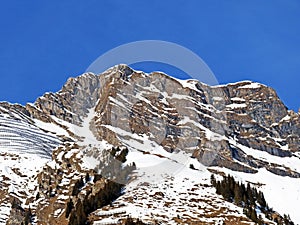 Snowy alpine mountain peak La Tarent located in a mountain massif of the Bernese Alps Alpes bernoises, Les Diablerets - Suisse photo