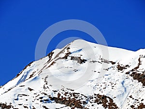 Snowy alpine mountain peak Pic Chaussy located in a mountain massif of the Bernese Alps Alpes bernoises, Les Diablerets - Suisse photo