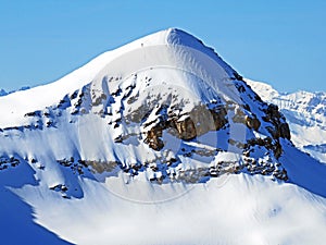 Snowy alpine mountain peak TÃªte Ronde located in the mountain massif Les Diablerets Rochers or Scex de Champ - Switzerland