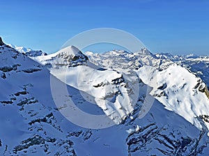 Snowy alpine mountain peak TÃªte Ronde located in the mountain massif Les Diablerets Rochers or Scex de Champ - Switzerland