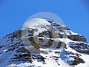 Snowy alpine mountain peak TÃªte Ronde in the mountain massif Les Diablerets Rochers or Scex de Champ, Switzerland / Suisse