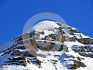 Snowy alpine mountain peak TÃªte Ronde in the mountain massif Les Diablerets Rochers or Scex de Champ, Switzerland / Suisse