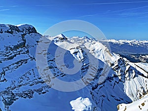 Snowy alpine mountain peaks Le Sommet des Diablerets and TÃªte Ronde located in the mountain massif Les Diablerets - Switzerland