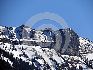 Snowy Alpine peak of Blaue Tosse in the Swiss mountain range of Pilatus and in the Emmental Alps massif, Schwarzenberg LU