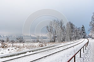 Snowy bank with railway tracks at Schliersee in Bavaria, Germany