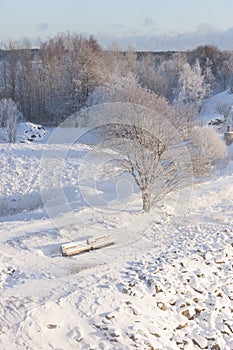 Snowy benches in a park at winter