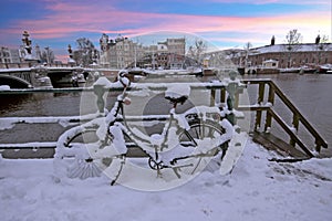 Snowy bicycle in Amsterdam city center the Netherlands