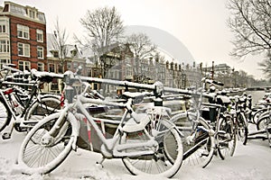 Snowy bikes in Amsterdam the Netherlands photo