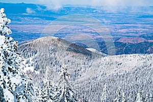Snowy Blizzard blankets the Mountains with Snow and Wide Valley of Northern New Mexico photo