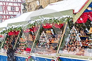 Snowy Christmas Market stalls at Town Hall in medieval town of Rothenburg ob der Tauber, Germany