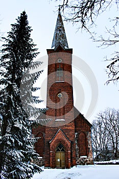 Snowy church Andreas in Ã„ksi, Estonia