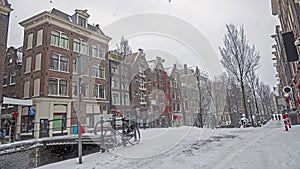 Snowy city Amsterdam in the red light disrict in the Netherlands in winter photo