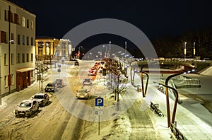 Snowy Commute: Traffic Trails Through Jelgava's Cold Winter Evening