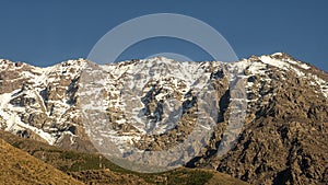 Snowy and craggy mountain top in the High Atlas Mountains  of Morocco.