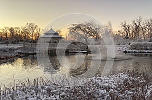 Snowy day on lake with gazebo