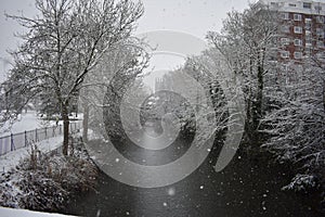 Snowy day in Leamington Spa UK, view over the Leam River, Pump Room Gardens - 10 december 2017
