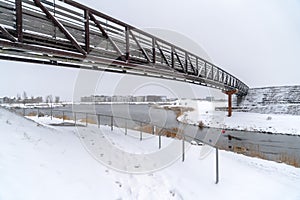 Snowy Daybreak Utah with bridge over Oquirrh Lake