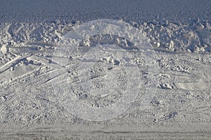 Snowy Driveway with Car Wheel Tracks