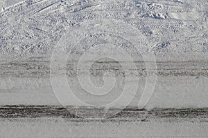 Snowy Driveway with Car Wheel Tracks