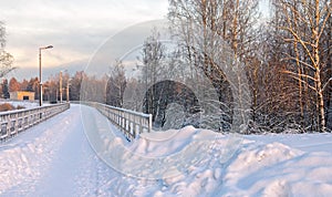 A snowy, frosty winter walking road