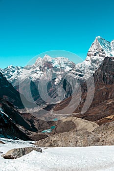 Snowy Glacier and Mountains Valley and Lakes in Himalaya vertical